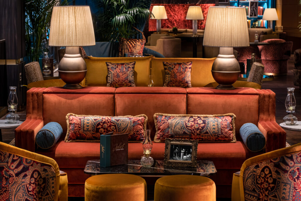 a room with a couch and lamps
