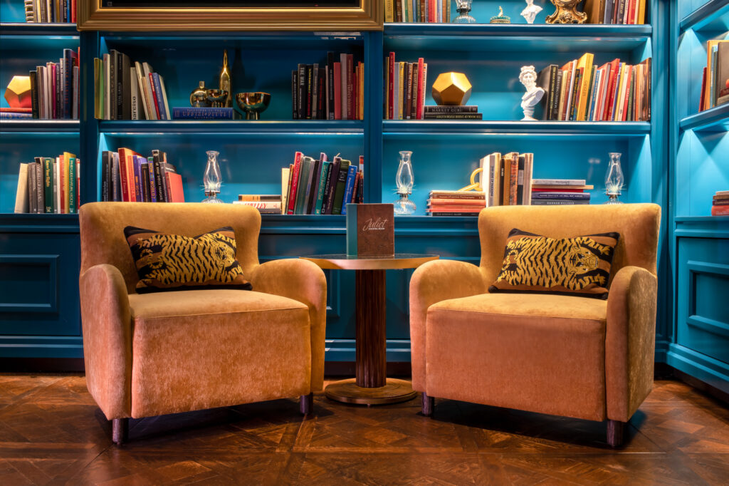 two chairs next to a table