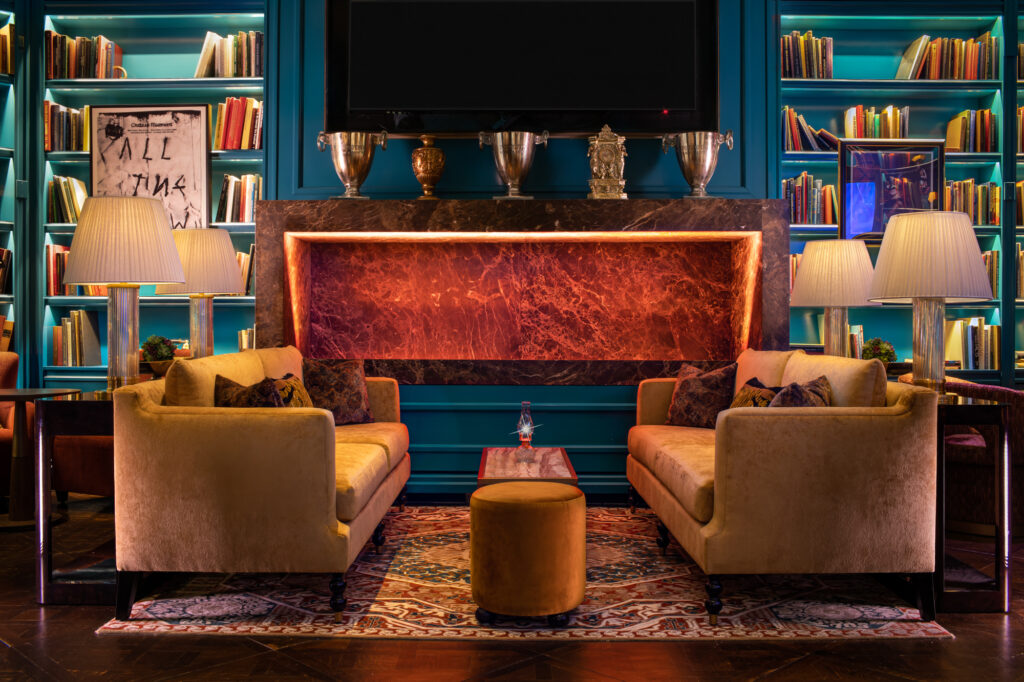 a room with a fireplace and couches
