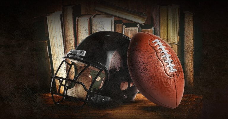 a football and helmet on a table