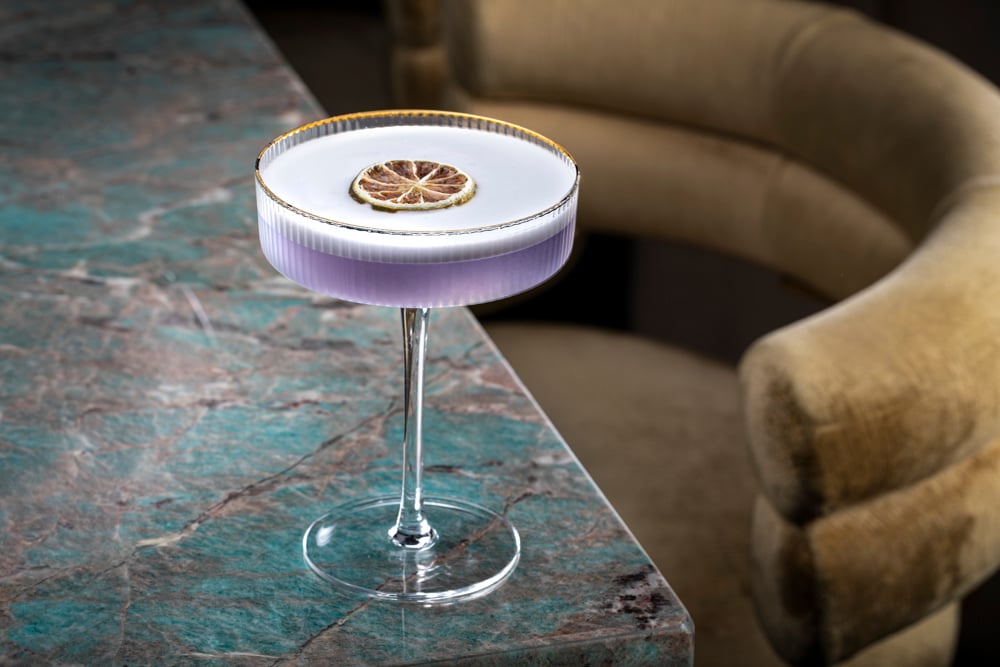 a glass with a drink in it